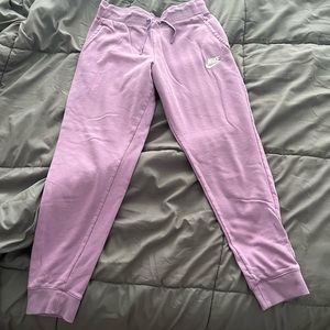 purple NIKE jogging pants